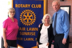 Joan Piela being inducted into The Fair Lawn Sunrise rotary